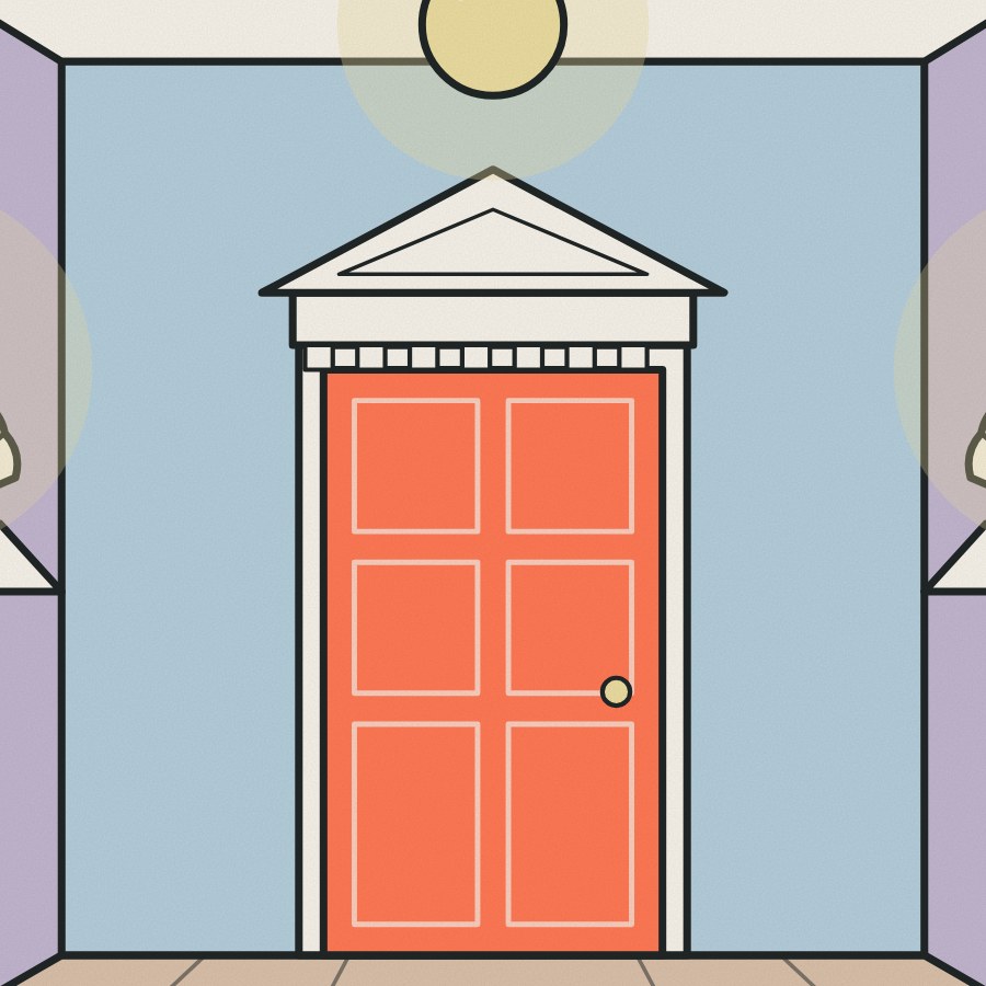 An overdoor pediment and a pair of shell wall lights frame the end of the hall.
