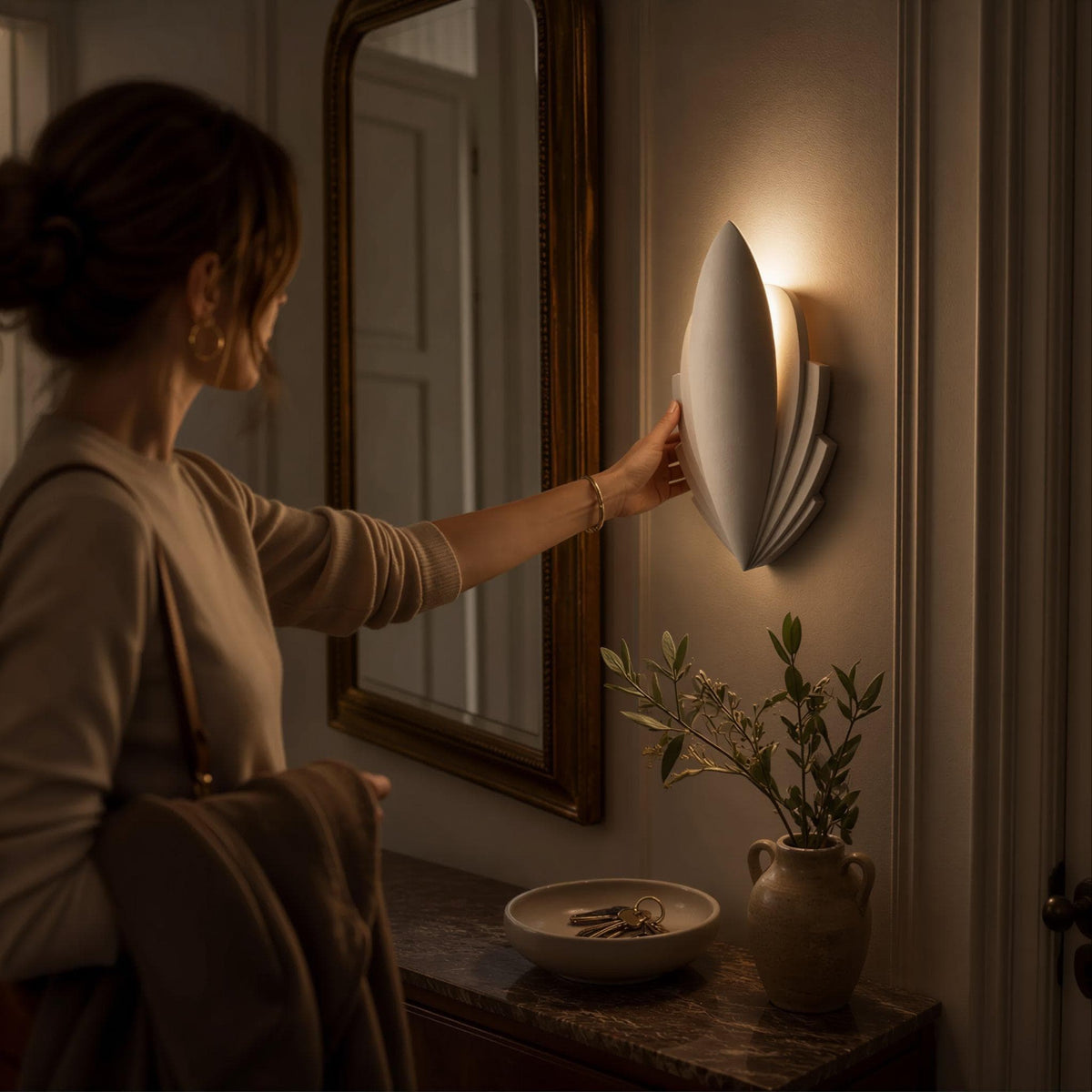 A Flare wall light being placed on a hallway wall